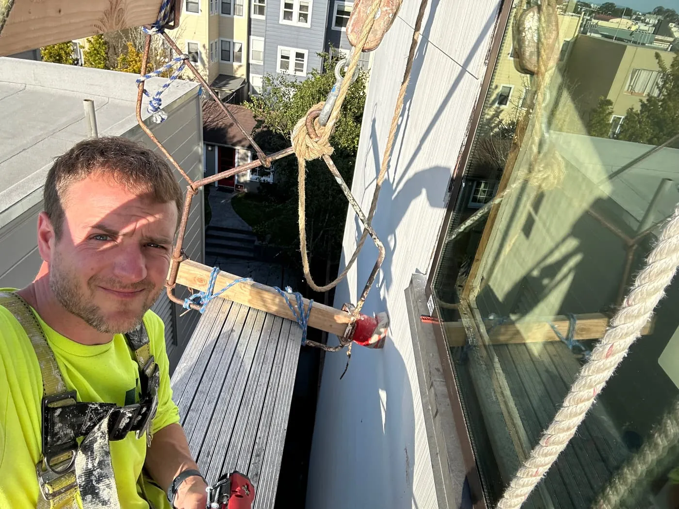 Angus MacDonald installing a window during the 21st Ave renovation